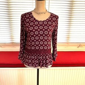 Feminine Takara geometric top.